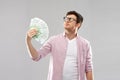 Proud young man in glasses with fan of euro money Royalty Free Stock Photo