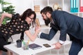 Prove how strong you are. Business partners get into armwrestling competition. Colleagues in competitive relations