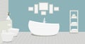 Provencal style bathroom with a fashionable bath,toilet, bidet, toilet paper,vase with snowdrops,a rack for towels and cosmetics,