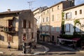 cozy narrow street with outdoor cafe and beautiful old buildings in provence france Royalty Free Stock Photo