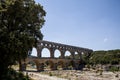 people walking near Pont du Gard (bridge across Gard) in Provence France Royalty Free Stock Photo