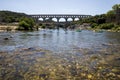 Pont du Gard (bridge across Gard) and people swimming on boats in Provence France Royalty Free Stock Photo