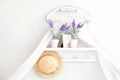 Provence, rustic style. Shabby chic in Provencal style. Village, country house. Shelf for hats, household trifles in a gentle Fren