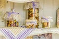 Provence-style decor, kitchen utensils on a hanging shelf, pasta closed in jars