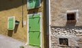 Provence style green wooden doors and window shutters