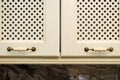 Provence style kitchen cabinet doors. Facade of beige kitchen cabinet figured door handles