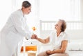 Providing care for elderly. Doctor visiting elderly patient at home. Royalty Free Stock Photo