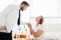 Providing care for elderly. Doctor visiting elderly patient at home. Royalty Free Stock Photo