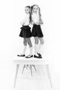 Providing children with education. Small children standing on table in classroom. Little children enjoying school break Royalty Free Stock Photo