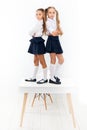 Providing children with education. Small children standing on table in classroom. Little children enjoying school break Royalty Free Stock Photo