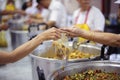 Providing food to the poor is helping people in a happy society