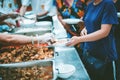 Providing free food for the poor to fill their stomachs and alleviate hunger : concept of feeding, helping and sharing Royalty Free Stock Photo