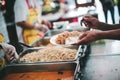 Providing free food to the poor Volunteers scooping out food to give charity to those who are hungry Royalty Free Stock Photo