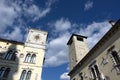 The yellow building of the town hall and the civic tower in Belluno Royalty Free Stock Photo