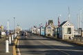 People enjoy a warm summer day in the historic harbor with old fishermen huts in Provincetown, USA Royalty Free Stock Photo