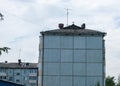 Provincial poor city. In the photo - the blank wall of the panel five-story building, the building is facing the viewer. Cheap