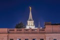 Provo City Center Temple with statue of angel and spire against blue evening sky Royalty Free Stock Photo