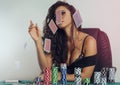 Provocative girl throwing cards in air