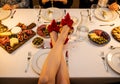 Elegant Dinner Party Setting Featuring Charcuterie Boards and Bold Red Heels. Royalty Free Stock Photo