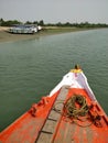 Prow of a bright red Fishing and tourist boat sailing in the Bay of Bengal- Sundarban, West Bengal, India- 9th Feb 2018