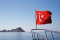 Prow of the yacht with the Turkish flag in the sea. Excursion on the ship Royalty Free Stock Photo