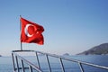 Prow of the yacht with the Turkish flag in the sea. Excursion on the ship Royalty Free Stock Photo