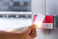 Proximity card door unlock, Hand security man using fingerprint scan on ID card reader access control system for identity