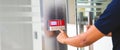 Proximity card reader door unlock, Close up hand security man using fingerprint scanning on access control system for identity