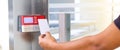 Proximity card reader door unlock, Hand security man using ID card on fingerprint scanning access control system for identity Royalty Free Stock Photo