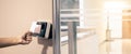 Proximity card reader door unlock, Hand security man using ID card on fingerprint scanning access control system for identity Royalty Free Stock Photo