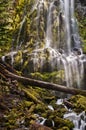 Proxy waterfall cascading over mossy rocks at sunset