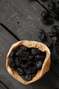 Prunes on a dark table, food background