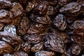 Prunes, dried plums, on display for sale on a market stall