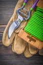 Pruning shears safety gloves soft wire tie on wood board gardeni Royalty Free Stock Photo