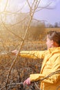 Pruning tree branches in the garden in spring, A woman cuts unnecessary branches from a fruit tree. Royalty Free Stock Photo