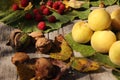 Autumn fruits on wooden table, fragrant yellow peaches, yellow - green leaves, raspberries Royalty Free Stock Photo