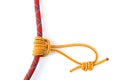 Prusik Knot or Triple Sliding Hitch formed with a 5mm yellow Prusik loop around a 9.8mm red climbing rope.