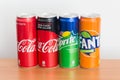 Cans of Coca-Cola, Coca-Cola Zero, Sprite and Fanta on wooden table. Royalty Free Stock Photo