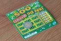 Lotto scratch ticket and 5 zloty coin