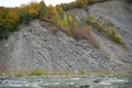 Prut river, autumn trees and geological mountain folds in Yaremche City, Ukraine