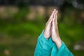 Prying hand of young kid with blurred background at evening