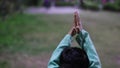 Prying hand of young kid with blurred background at evening