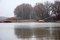 Pryluky, Chernihiv / Ukraine - 11/19/2020: Amphibious Excavators. River Cleaning