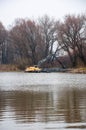 Pryluky, Chernihiv, Ukraine - 11/19/2020: Amphibious Excavators. River Cleaning