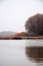 Pryluky, Chernihiv, Ukraine - 11/19/2020: Amphibious Excavators. River Cleaning.