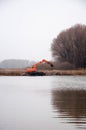 Pryluky, Chernihiv, Ukraine - 11/19/2020: Amphibious Excavators. River Cleaning