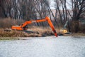 Pryluky, Chernihiv, Ukraine - 11/19/2020: Amphibious Excavators. River Cleaning