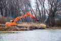 Pryluky, Chernihiv, Ukraine - 11/19/2020: Amphibious Excavators. River Cleaning.