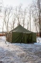 Pryluky, Chernihiv, Ukraine - 01/19/2021: Canvas tent on the bank of winter river