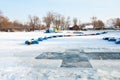 Pryluky, Chernihiv, Ukraine - 01/19/2021: A hole in the shape of a cross in a frozen river